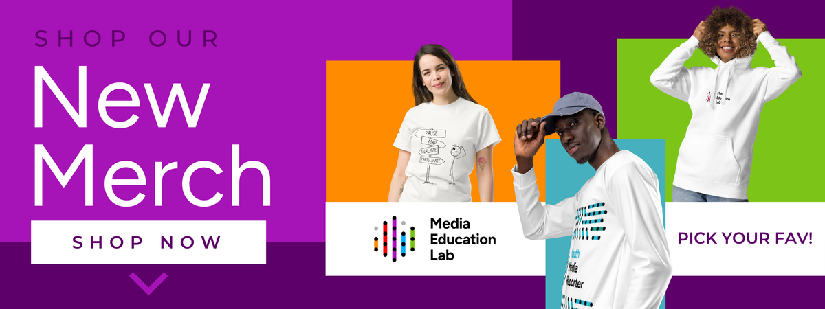 Promotional banner for a clothing store featuring three models wearing different apparel items: a white graphic t-shirt, a white long-sleeve shirt with a blue graphic, and a white hoodie. The background is a vibrant mix of purple, orange, teal, and green blocks with text reading 'SHOP OUR New Merch SHOP NOW' and 'PICK YOUR FAVI'.